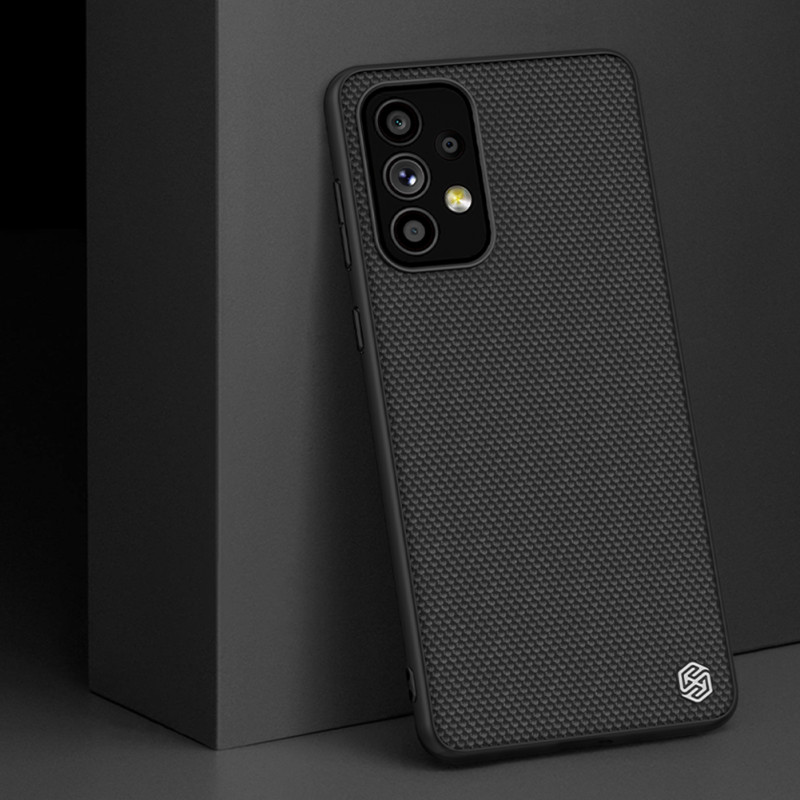 Nillkin Textured Case tvirtas sustiprintas dėklas su gelio rėmeliu ir nailonine nugara, skirta Samsung Galaxy A73 juodai