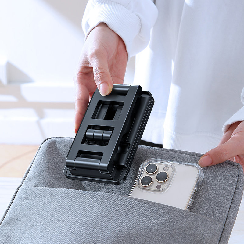 Baltas sulankstomas telefono laikiklis